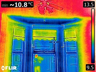 Photograph was taken with our FLIR thermal imaging camera in a Mid-terrace property interwar period, showing the heat loss around a bay window.